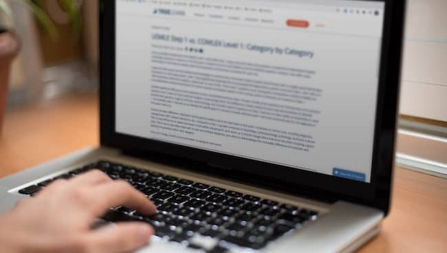 Someone typing on a computer
