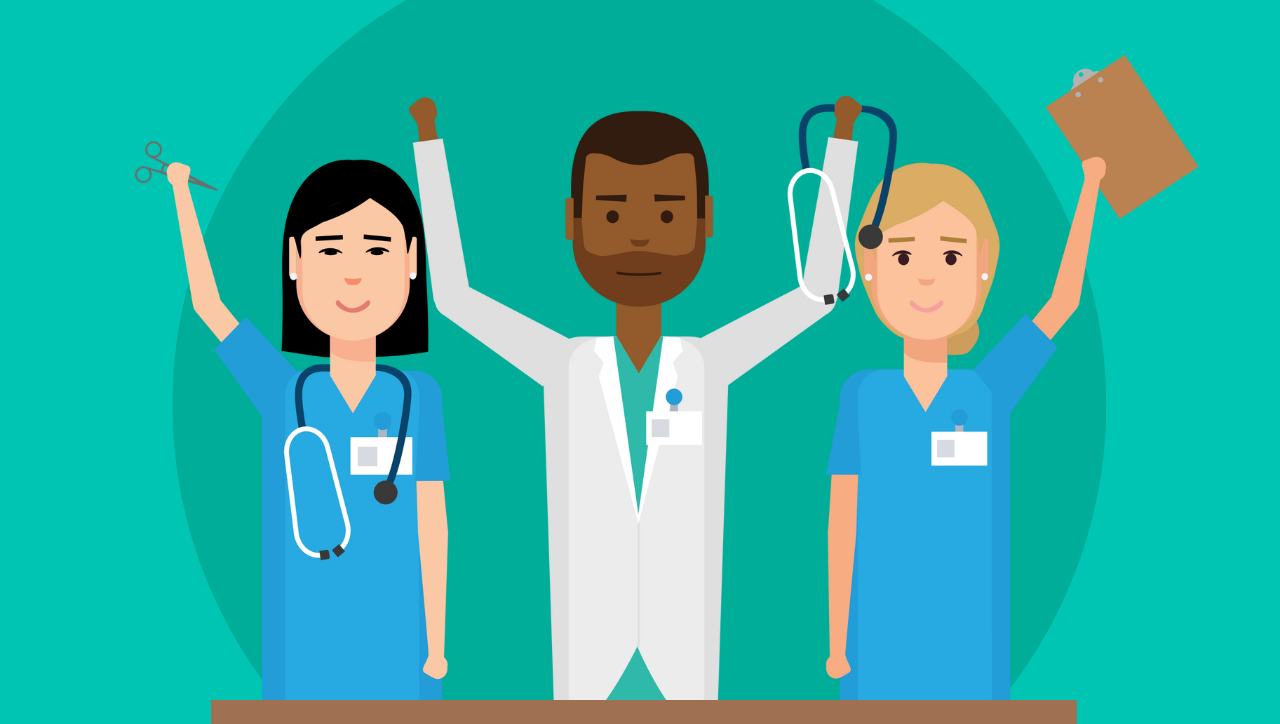 Three OBGYN residents in front of a desk